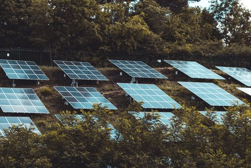 Photo of solar panels on a hillside.