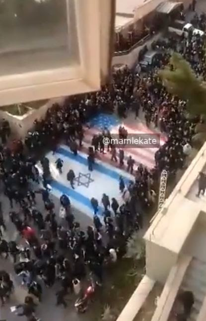 The crowd turned on the few who walked over the murals