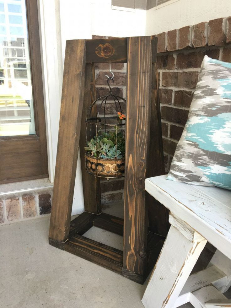DIY Angled Planter Stand. So cute for hanging plant baskets! 