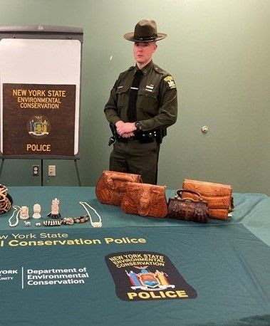 ECO stands at a table with illegal items on it