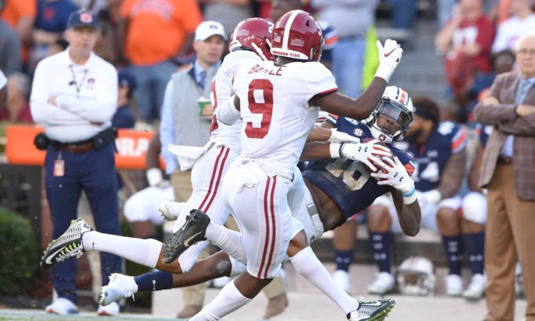 Jordan Battle (No. 9) trying to help Patrick Surtain II cover Seth Williams of Auburn in 2019 Iron Bowl