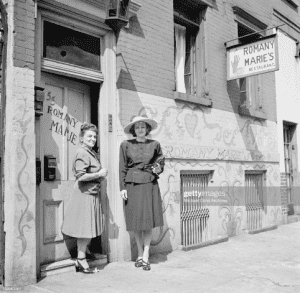 Marie Marchand in front of her restaurant door in New York