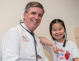 Dr. Martin and a patient share a smile after a visit at Children’s National Health System.