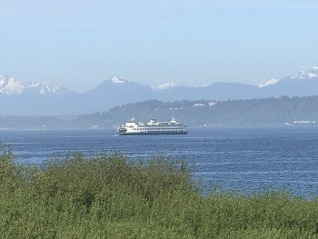 Ferry seen traveling between Edmonds and Kingston on a sunny day