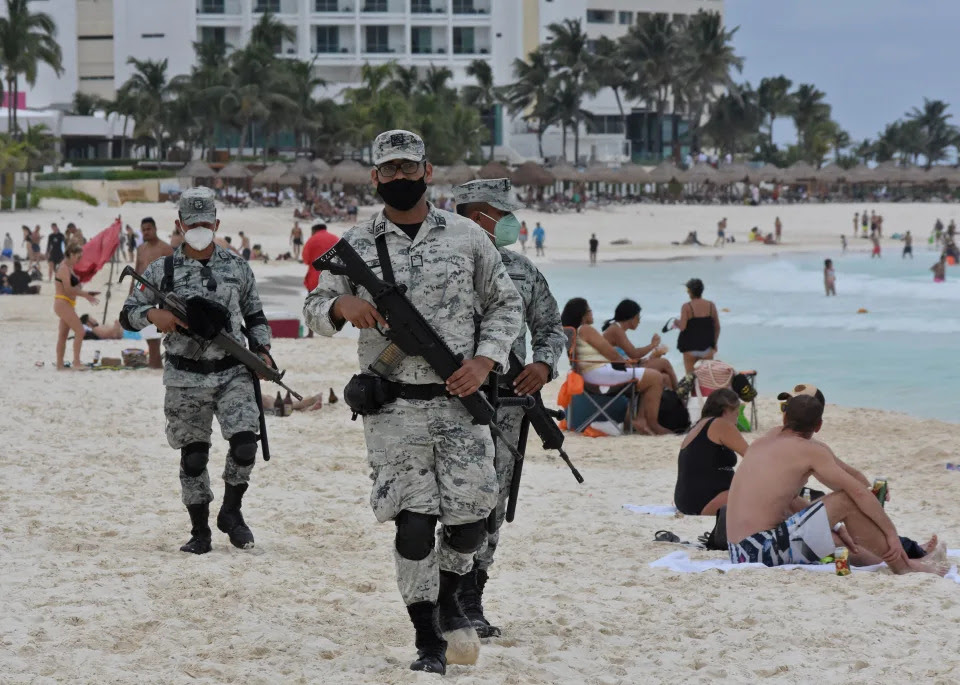 Members of the newly created Tourist Security Battalion of the National Guard patrol a beach in Cancun, Quintana Roo State, Mexico, on December 2, 2021. - On November 17, Mexico created a