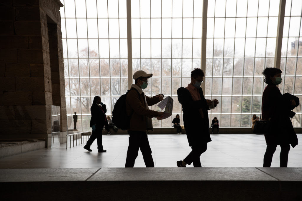 Tourists wearing protective masks at the Met. Photo by Jeenah Moon/Getty Images.