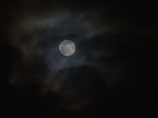 adam-jones-full-moon-and-passing-clouds-at-night