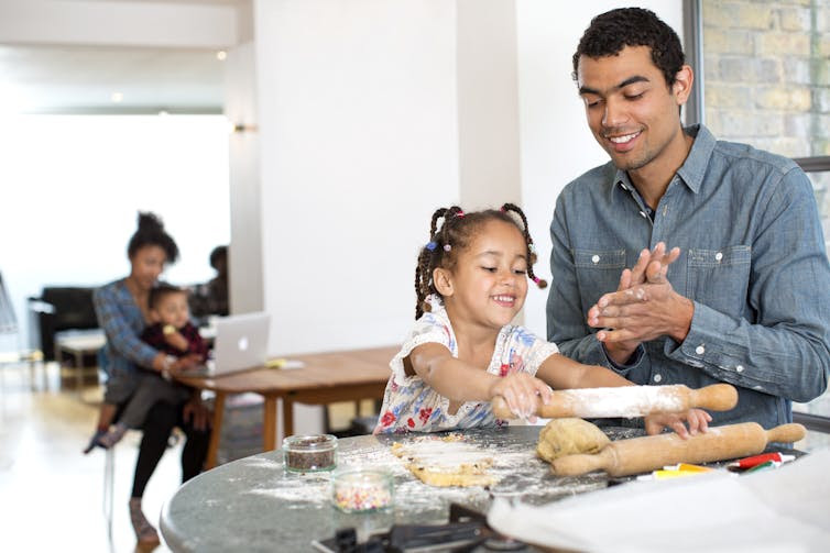 Daughter and dad baking together