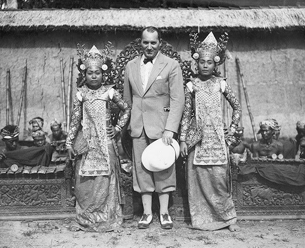 Robert Ripley standing with two Balinese dancers. He considered the people of Bali to be