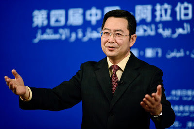Qu Yingpu, publisher and editor-in-chief of China Daily, delivers a video speech at the summit