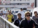In this Monday, Dec. 3, 2007, file photo, a stream of pedestrians cross the Gateway to the Americas International Bridge from Mexico into the U.S. in Laredo, Texas. (AP Photo/Eric Gay) ** FILE **