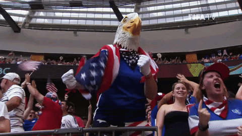 Soccer fan in eagle mask cheering