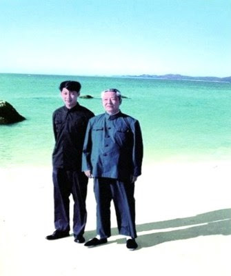 File photo of Xi Jinping (L) with his father Xi Zhongxun. /CMG