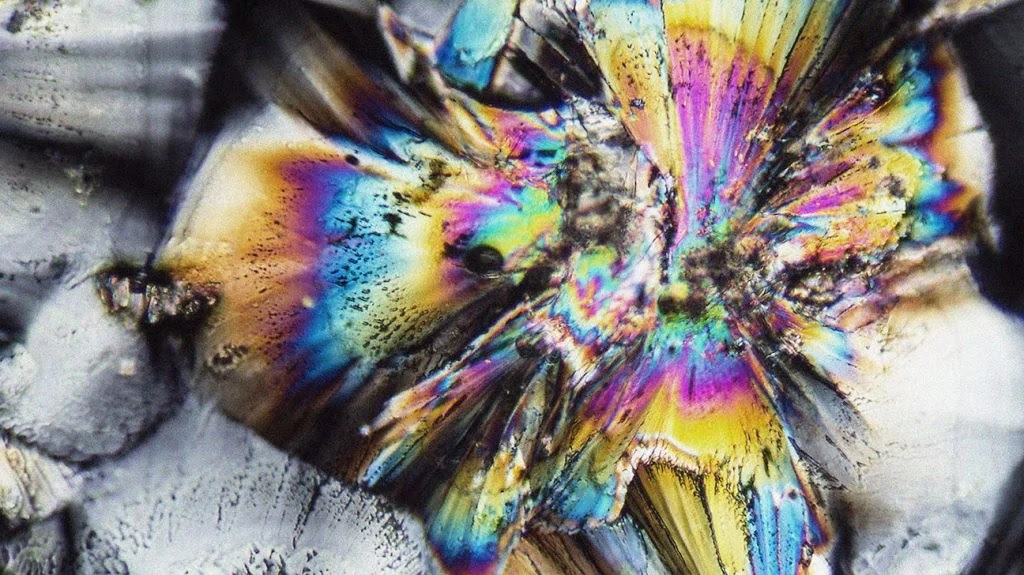 microscopic shot showing micro crystals of a zinc preparation illuminated with polarized light