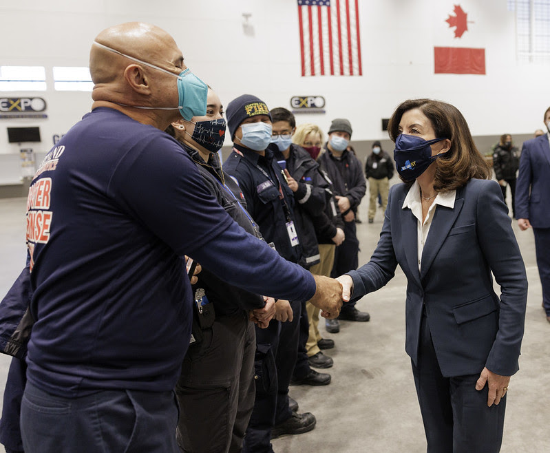 Governor Hochul shakes hands with first responder