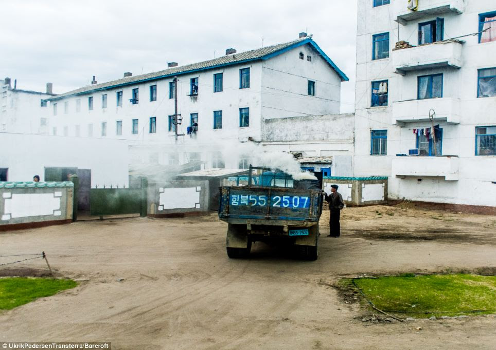 Hard at work: The regime in Pyongyang have previously banned photographers for taking images of people relaxing, but are keen to promote snaps of people at work to promote the country