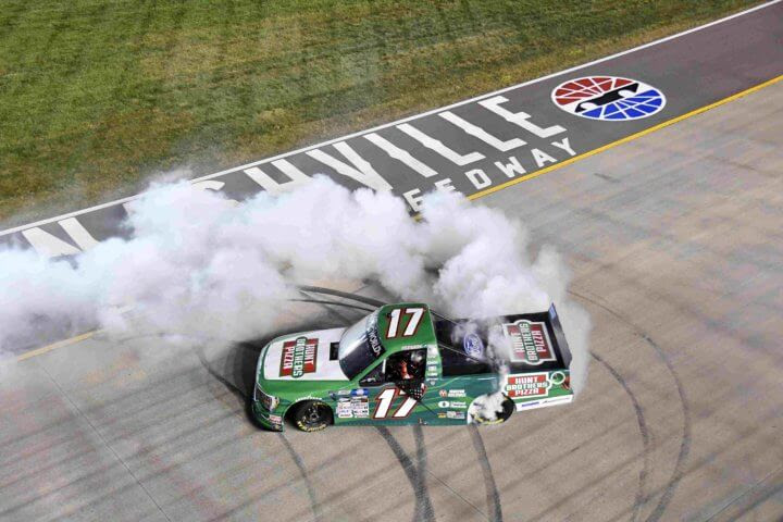 Ryan Preece, driver of the #17 Hunt Brothers Pizza Ford, celebrates with a burnout after winning the NASCAR Camping World Truck Series Rackley Roofing 200 at Nashville Superspeedway on June 24, 2022 in Lebanon, Tennessee. (Photo by Logan Riely/Getty Images)