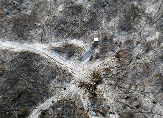 An aerial view of an illegal deer baiting site is shown.