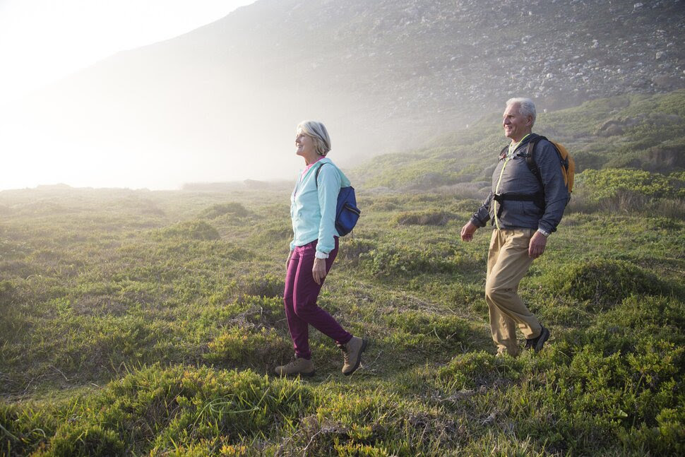 An older couple hiking.