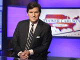 Tucker Carlson, host of &#39;Tucker Carlson Tonight,&#39; poses for photos in a Fox News Channel studio on March 2, 2017, in New York. (AP Photo/Richard Drew, File) **FILE**