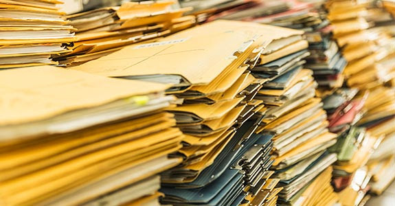 Stacks of paper files | Alan Graf/Cultura/Getty Images