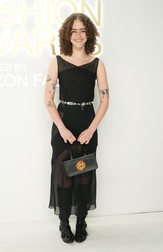 Image may contain Bag Accessories Handbag Person Adult Dress Clothing Purse Fashion Shoe Footwear and Tattoo