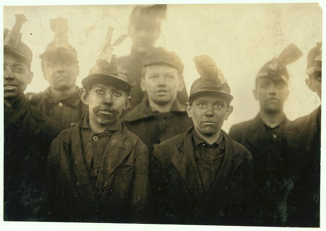 Child coal miners in a black-and-white photo.