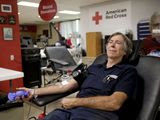 Mike Schneider donates blood at the Red Cross Blood Donation Center, Tuesday, June 15, 2021, in Tulsa, Okla. (Mike Simons/Tulsa World via AP)