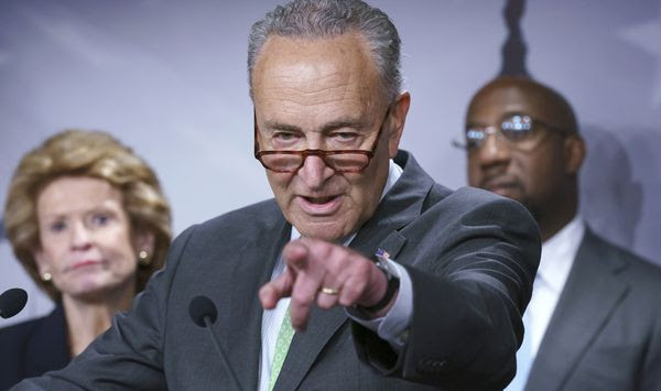 Senate Majority Leader Chuck Schumer, D-N.Y., flanked by Sen. Debbie Stabenow, D-Mich., left, and Sen. Raphael Warnock, D-Ga., holds a news conference to talk about the benefits of the Child Tax Credit, at the Capitol in Washington, Thursday, July 15, 2021. The U.S. government is starting to deposit child tax credit money into the accounts of more than 35 million families as part of coronavirus relief. (AP Photo/J. Scott Applewhite)