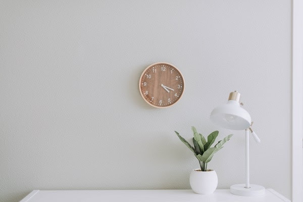 minimalism desk, clock, lamp and plant