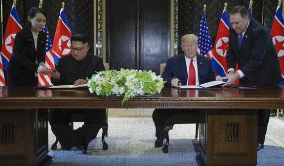 Trump, Kim Jong-un Sign Document, Pledge to Work
Together for Peace