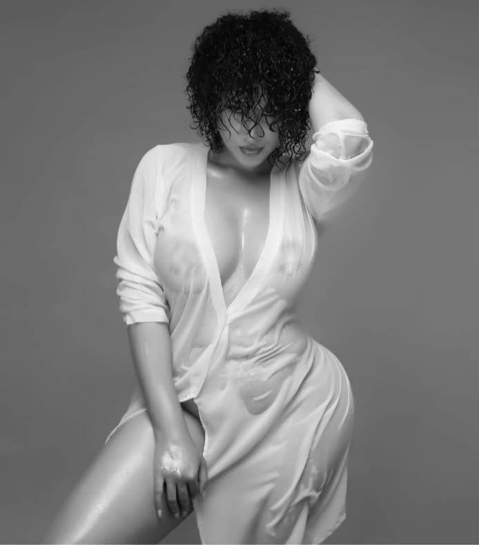 Actress, Caroline Danjuma sends pulses racing as she puts her boobs on display while posing in sheer shirtdress