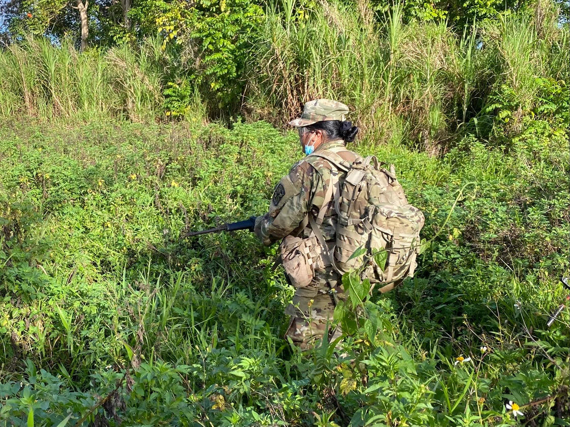 NMC ROTC Cadet Mariah Katelyn Gapasin stayed motivated while carrying a ruck sack during extreme heat on Guam during the ROTC Spring 2021 Field Training Exercise from April 8-11, 2021.