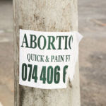 1024px-Abortion_Quick_&_Pain_Free_sign,_Joe_Slovo_Park,_Cape_Town,_South_Africa-3869