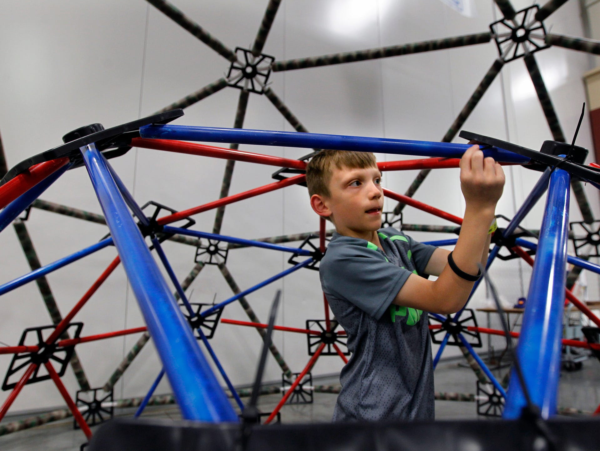 Josh Larsen, 8, of Franklin works in the Geodesic Dome