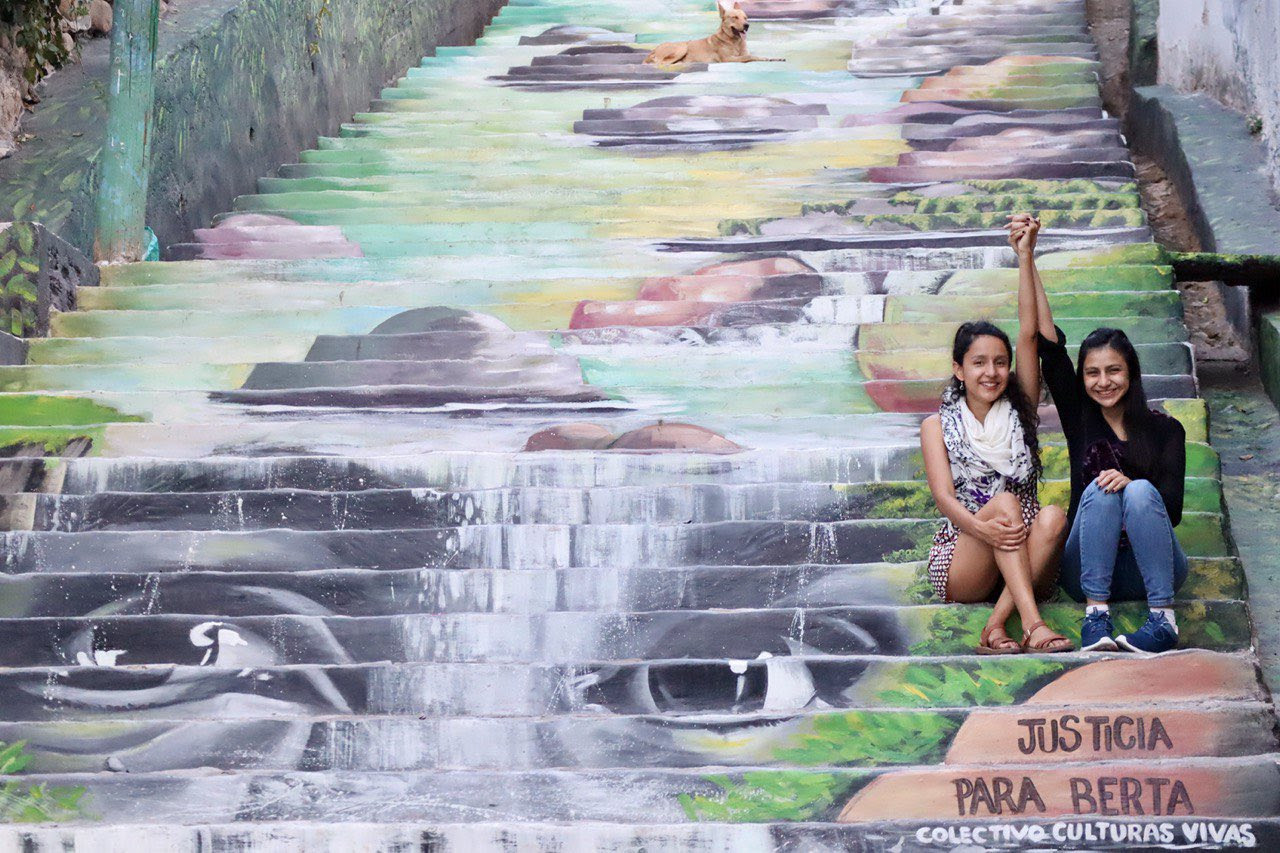 Bertha and Laura Zúniga Cáceres at a mural made by el Colectivo Culturas Vivas, Tegucigalpa, Honduras, 2021.
