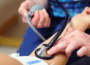 Veteran getting their blood pressure checked Veteran getting their blood pressure checked