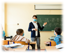 Teacher in classroom with mask