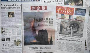 Front pages of the China Daily (left), the Beijing News (center), and the Global Times (right) featuring reaction to the Notre Dame Cathedral fire, which took place on April 15, 2019.