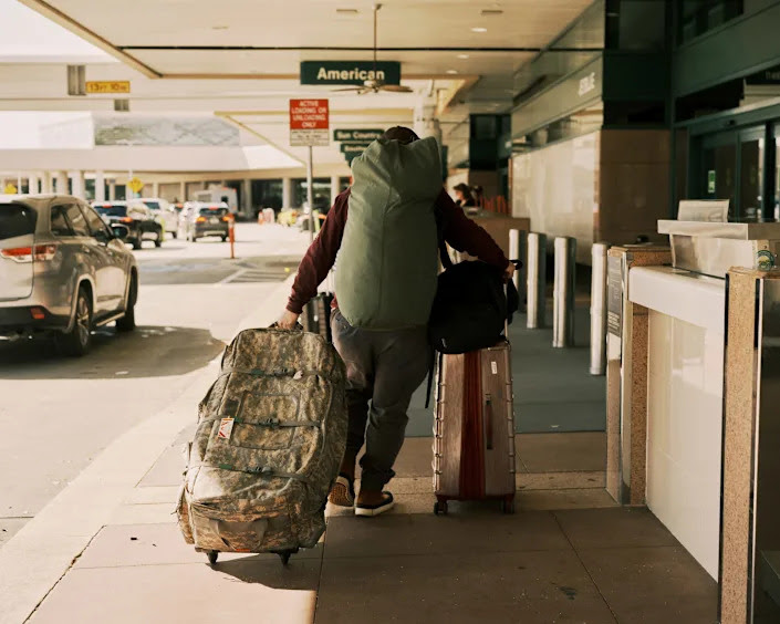 Hector, a former Marine, heads to a flight to Warsaw, Poland from Sarasota-Bradenton Regional Airport in Sarasota, Fla. on Friday, March 4, 2022, to help train Ukrainians. (Zack Wittman/The New York Times)