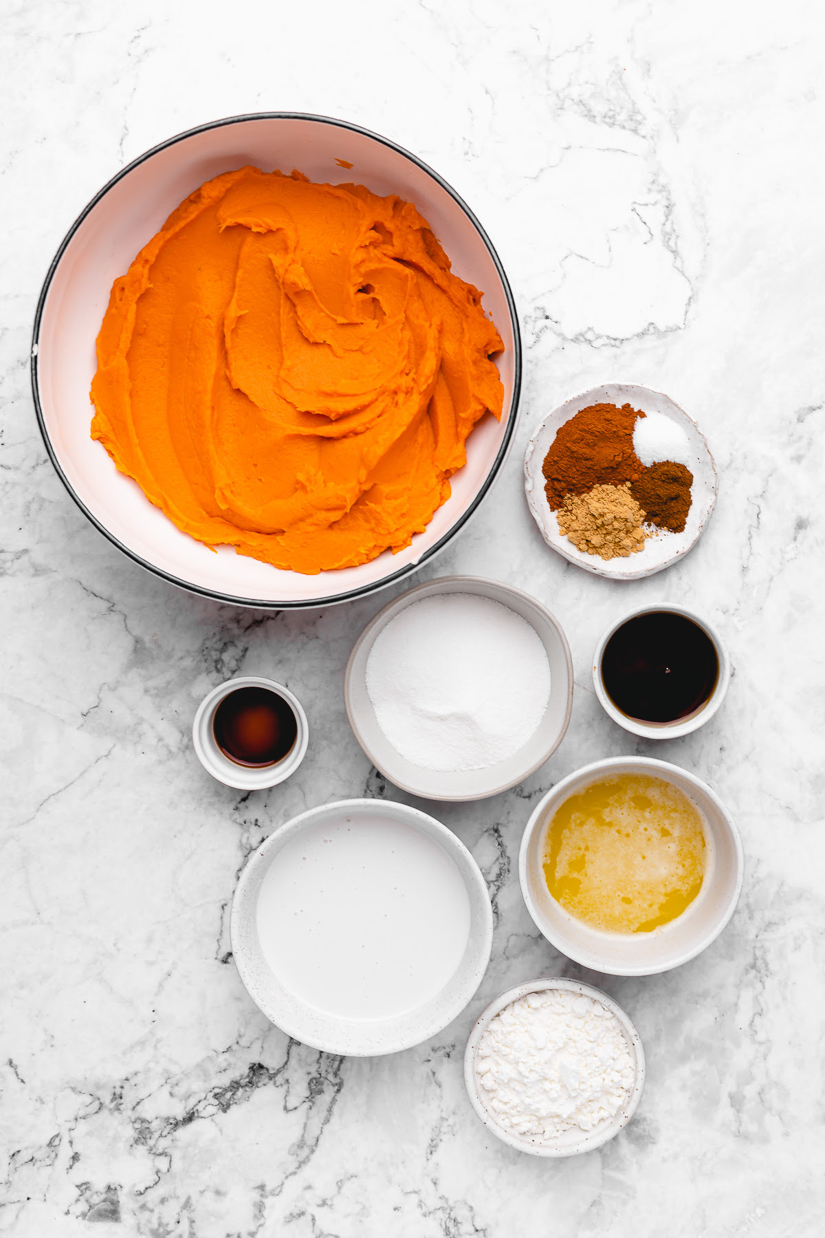 This Vegan Sweet Potato Pie is just like the Southern classic, but made without the dairy and eggs. Sweet, creamy, and perfect! Overhead view of vegan sweet potato pie ingredients