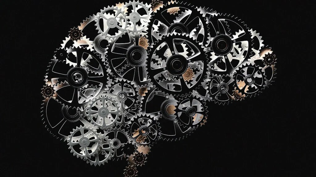 illustration of brain shape made out of metal cogs on a black background