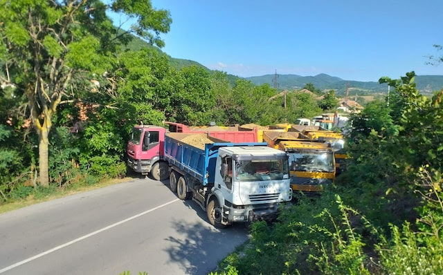 Trucks are seen blocking the road near the Jarinje Border Crossing in Mitrovica, Kosovo