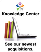 OMHRC logo. Knowledge Center. Laptop propped up by books. See our latest acquistions.
