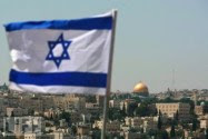 The Flag of Israel flying in Jerusalem with the Temple Mount in the distance