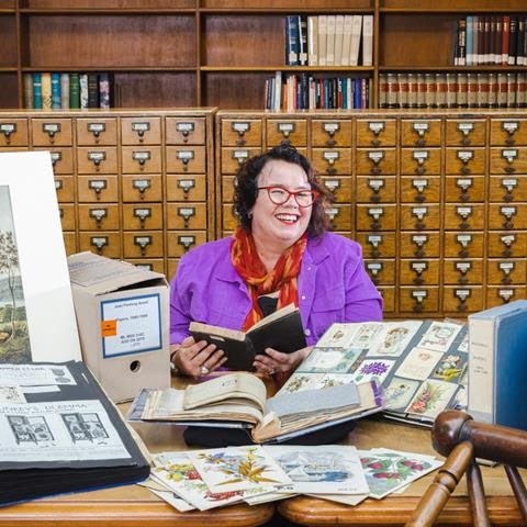 Kate Evans in the Mitchell Library reading room