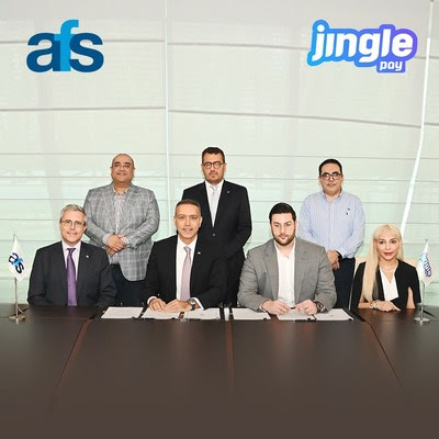 CEOs of Jingle Pay and AFS signing the strategic partnership