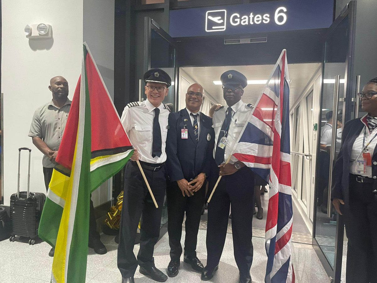 British Airways Captain, Marc Chan (left) and Alan Brooks (right) with an aviation official on Monday