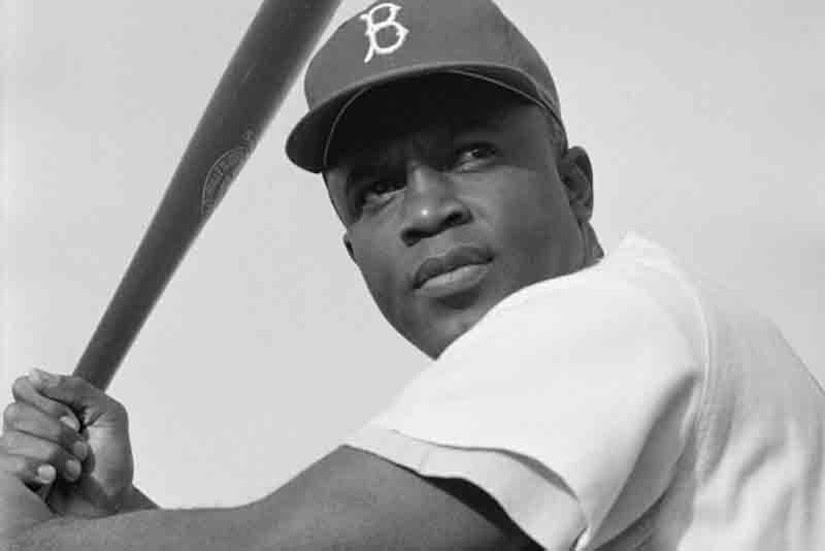 Baseball great Jackie Robinson poses for a photo.