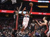 Washington Wizards forward Rui Hachimura (8), of Japan, goes to the basket next to Miami Heat forward Bam Adebayo (13), forward Solomon Hill (44) and guard Duncan Robinson, second from right, during the second half of an NBA basketball game, Sunday, March 8, 2020, in Washington. (AP Photo/Nick Wass) **FILE**